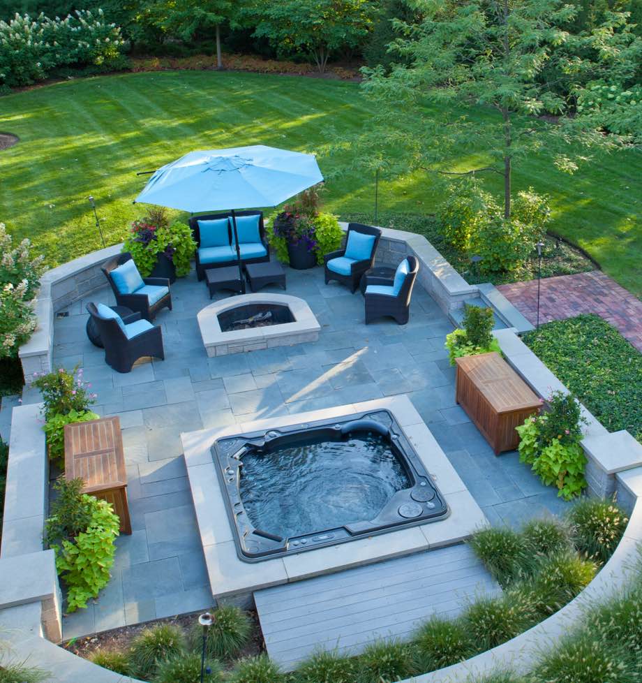 High angle view of patio with firepit and hot tub